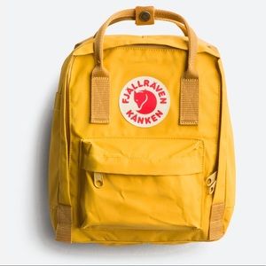 Mini yellow Fjallraven kanken backpack